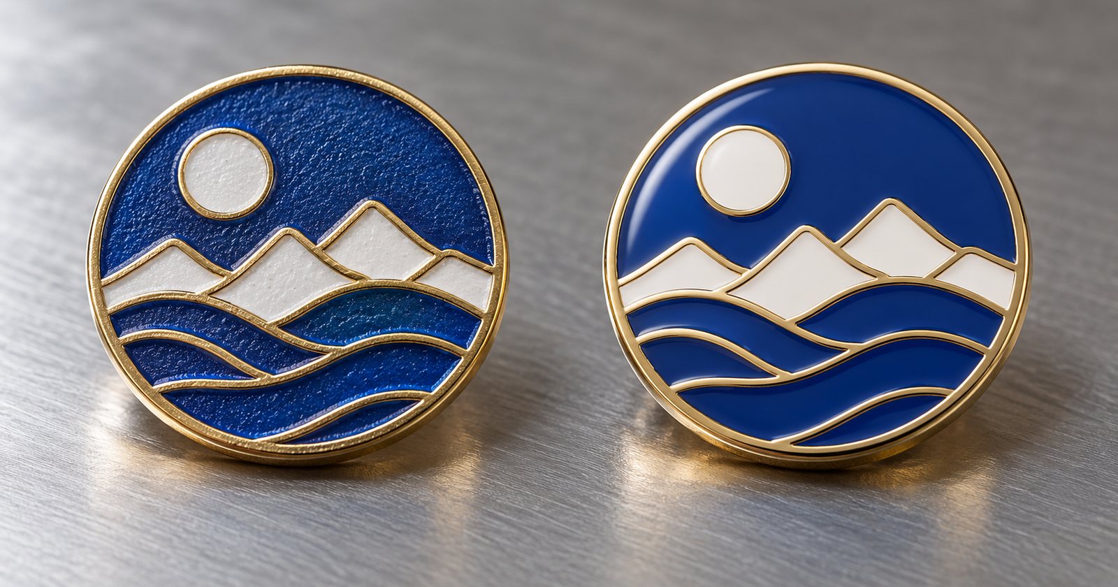 Two enamel pins side by side: soft enamel with raised metal lines and hard enamel polished flat